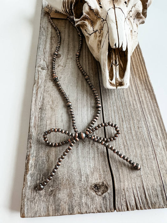 NAVAJO STYLE PEARL BOW NECKLACE