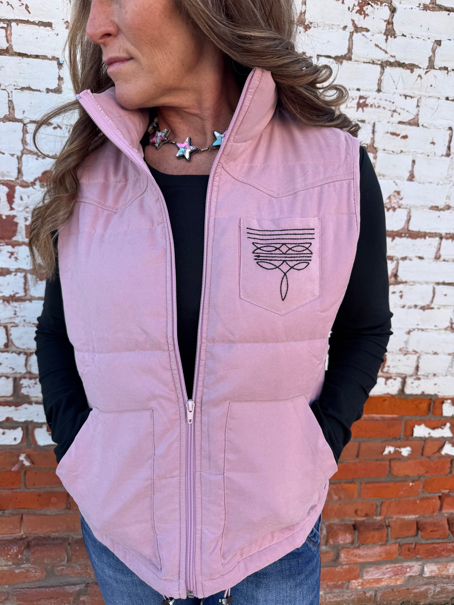 PUFFER VEST WITH BOOT STITCH DETAIL