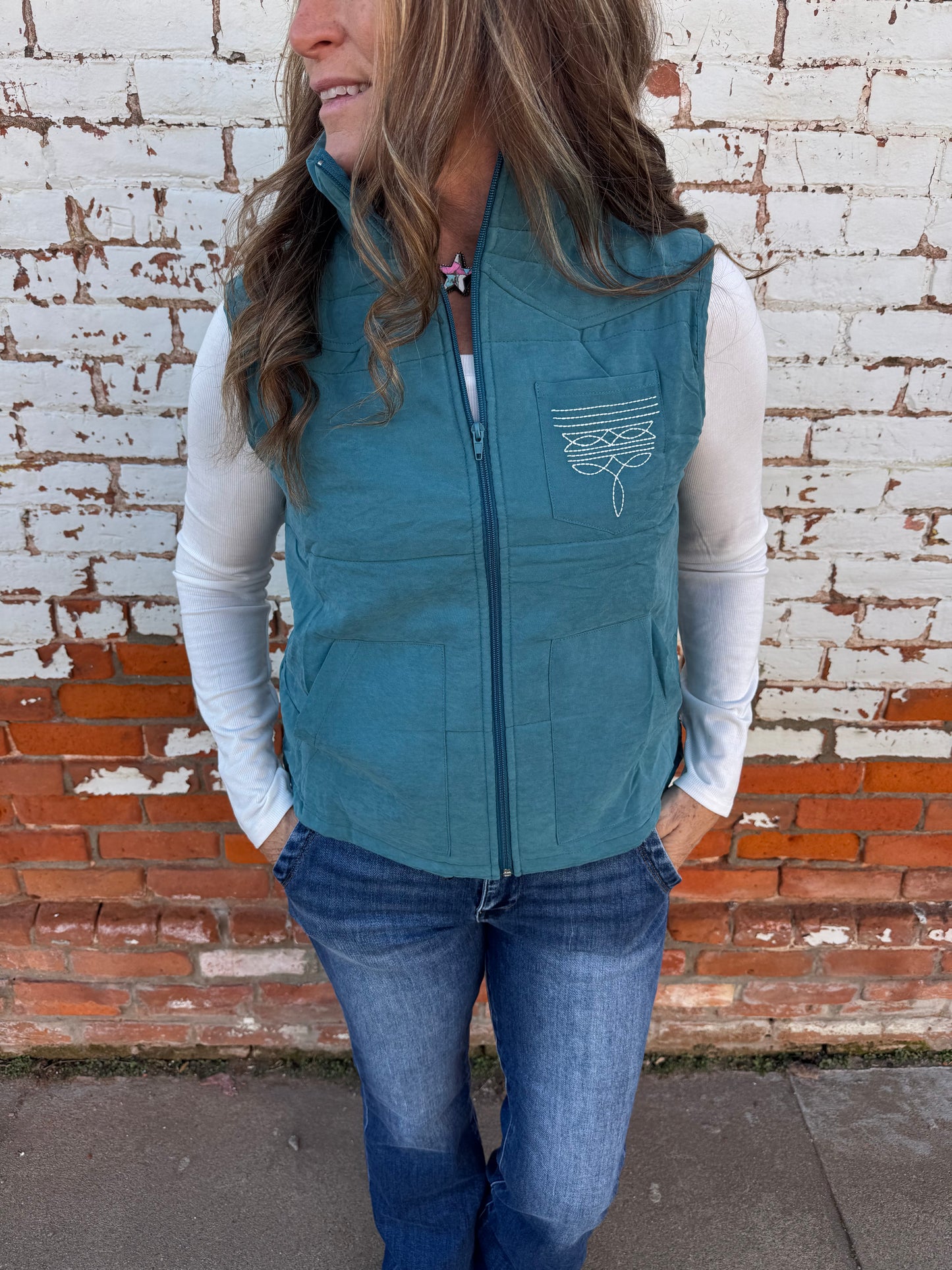 PUFFER VEST WITH BOOT STITCH DETAIL